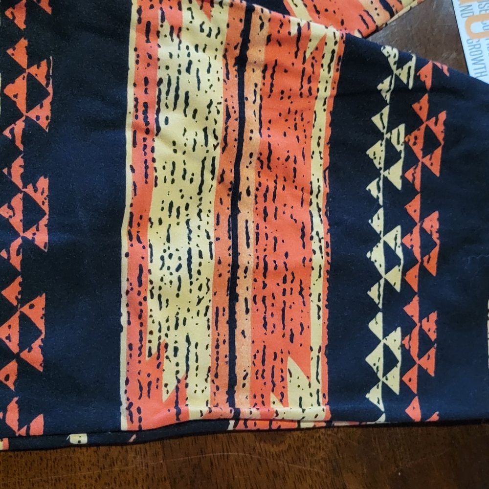 LuLaRoe Black Leggings with Orange & Yellow Tribal Accents - Picture 3 of 4